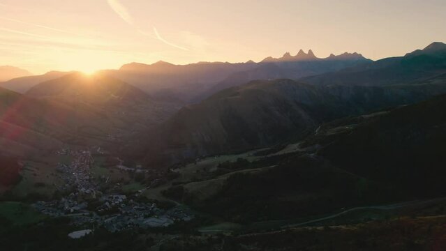 French Alps landscape of sunrise shine over Lac Guichard with rocky mountain and Aiguilles d arves massif in autumn at France