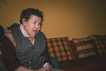 portraits of an old woman in her home