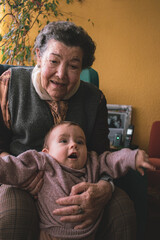 great-grandmother plays with her granddaughter