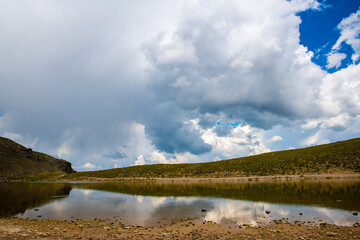 Tranquil Waters of At Goli Pond Under Gathering Storm Clouds, Ardabil Province, Iran