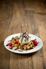 plate of belgian waffle with ice cream