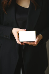 Woman's hands holding prescription pills packeging with blank label with copy space for text