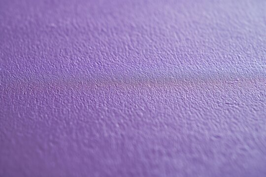 A close-up image showcasing the texture and color of a purple wall background in a raw and artistic style.