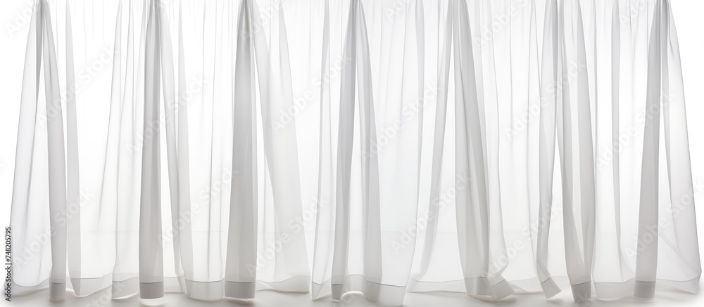 Poster a white curtain with sheer fabric is seen hanging, creating a delicate and airy ambiance. the sheer 