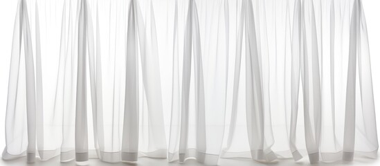 A white curtain with sheer fabric is seen hanging, creating a delicate and airy ambiance. The sheer fabric adds a subtle texture to the curtain, giving a soft and elegant touch to the room. - obrazy, fototapety, plakaty