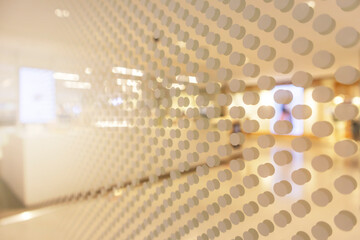 A mirror reflects the polka dots on a bar counter in a department store.