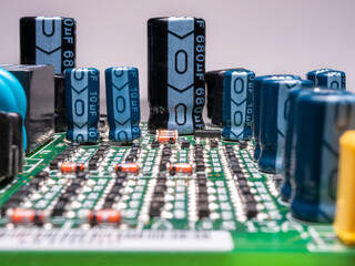 Green printed circuit board with electronic components. Selective focus.
