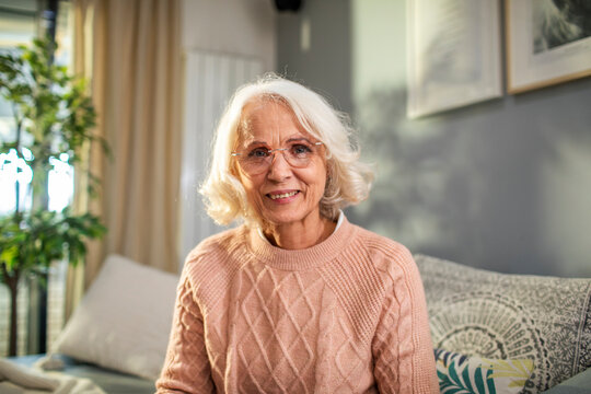 Smiling portrait of a elderly woman at home