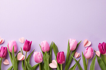 Springtime smiles: creating unforgettable spring greetings. Top view shot of pink tulips and...