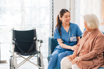 Elderly senior woman, asian woman doctor nursing home to helping take care to retirement patient who sitting on wheelchair, caregiver nurse support to medical health care insurance at home or hospital