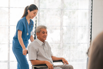 asian woman doctor nursing home to helping take care to retirement patient who sitting on wheelchair, caregiver nurse support to medical health care insurance at home or hospital, elderly senior man - obrazy, fototapety, plakaty