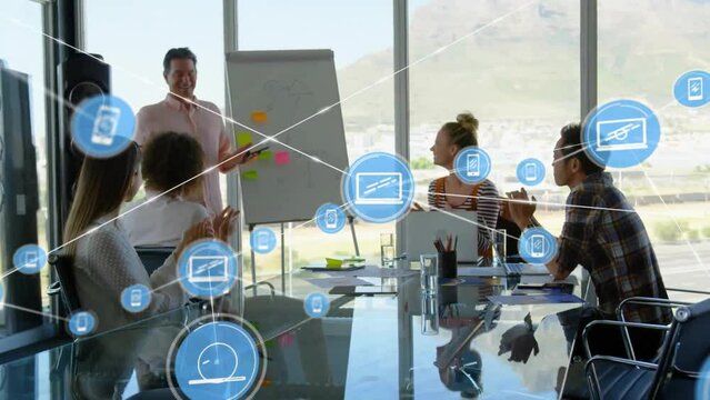 Animation of network of connections with icons over diverse business people in office