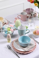 Festive table setting with painted eggs. Easter celebration