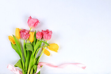 Abstract floral arrangement, bouquet of tulips on a light table, hello spring concept, template for design, still life with flowers,