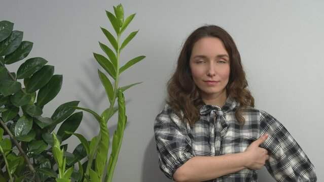 Person practicing EFT. Female tapping under arm (UA) meridian point. 
