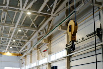No people shot of part of lifting equipment in modern factory interior, copy space