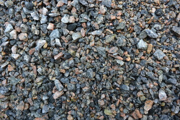 Building materials and fettling background, light crushed stone after rain.