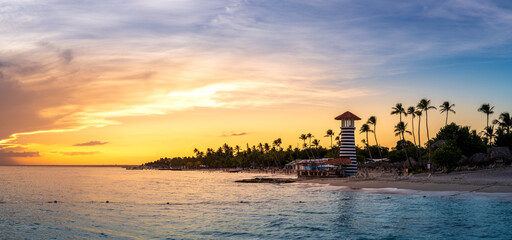 Panorama of dramatic sunset at Bayahibe Beach, La Romana, Dominican republic. - obrazy, fototapety, plakaty