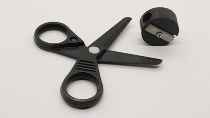 Black scissors with and black pencil sharpener a small size