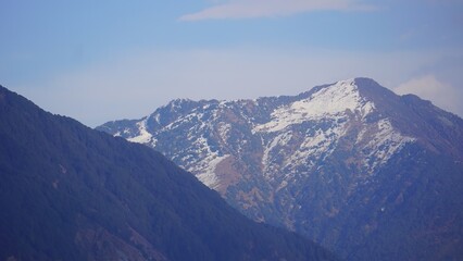 landscape of beautiful snow mountains with mist