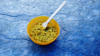 bowl of tasty maggie with spoon