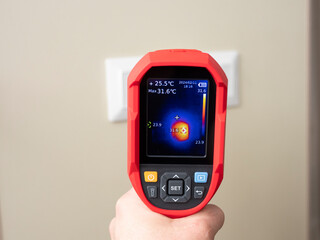 Thermal imaging inspection of heating equipment. Inspection of a heating of household outlets and...