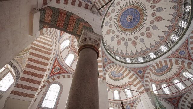View of the dome cover of the Valide-i Atik Mosque in Istanbul. The camera rotates around the support column.