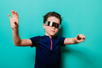 A child in a visor and sporty shirt takes on a superhero stance against a playful turquoise background