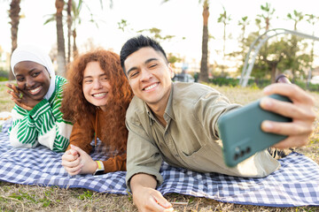 Diverse Students Enjoying Picnic and Taking Selfie