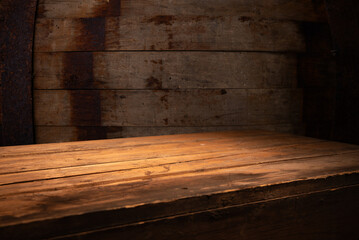 Old wood table with blurred concrete block wall in dark room background. High quality photo - 748263304