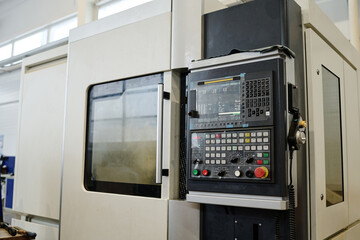 No people shot of CNC machine in modern factory interior, copy space