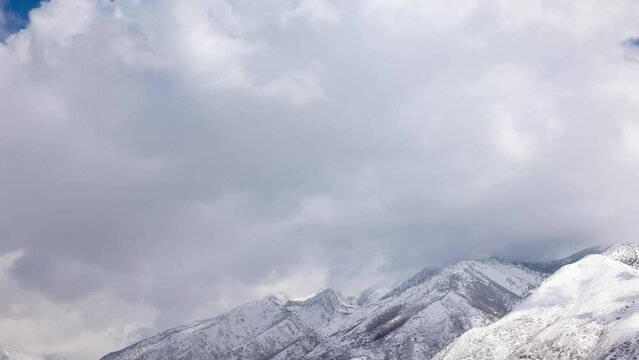 Time lapse of clouds over the snow covered Wasatch Mountains near Salt Lake City, Utah.