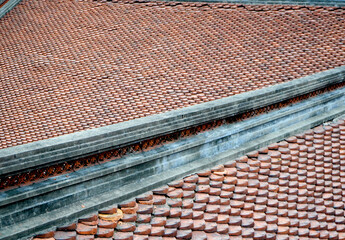 Clay roof tiles on old building, monastery in asia