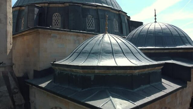 Drone view rising from the entrance portico to the dome of Ankara Cenab-ı Ahmet Pasha Mosque.