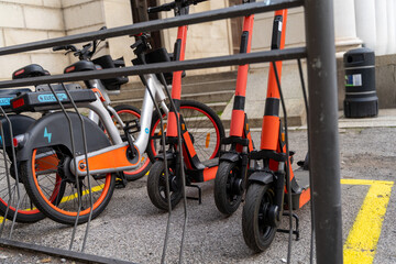 electric scooter and electric bicycle rental subscription service in urban parking in city © Marino Bocelli