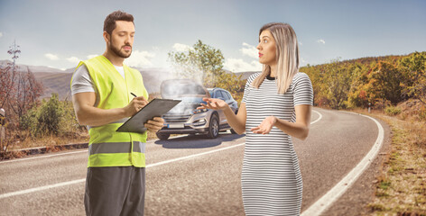 Road help worker writing a document and standing with a broken SUV and a woman driver