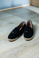 Women's black loafers without a heel for every day. Collection of summer women's shoes. Stylish...