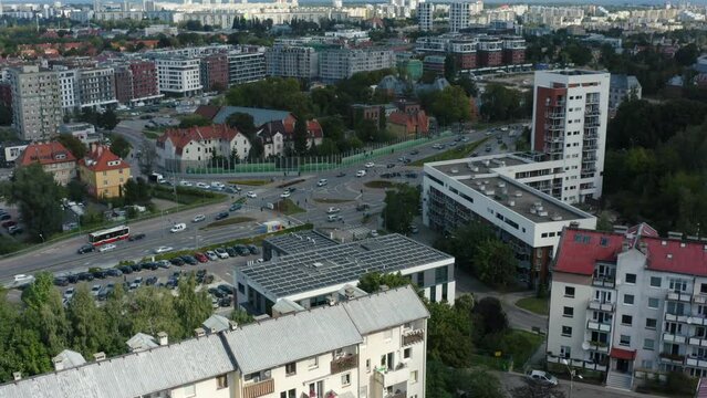 Aerial view of an office building with solar panels on a flat roof in the city of Gdansk, Poland. Can save energy. Solar or renewable energy or clean energy.
