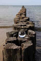 lens ball on a wooden pier (focus in lens ball)
