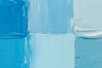 Macro close-up of squares painted with acrylic paint in light blue and turquoise hues. High...