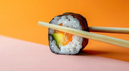 Foto op Plexiglas sushi with wooden chopsticks on it © olegganko
