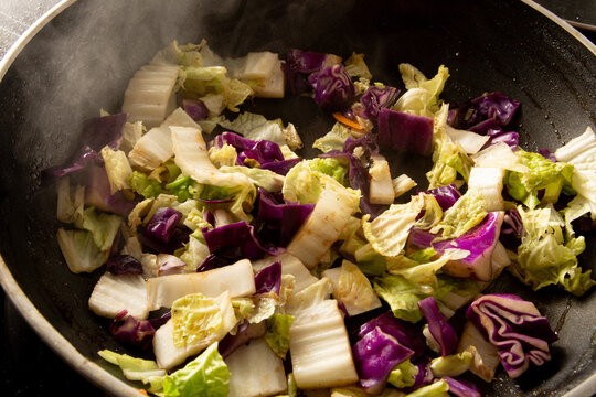 Steamed vegetables in a skillet pan in close up