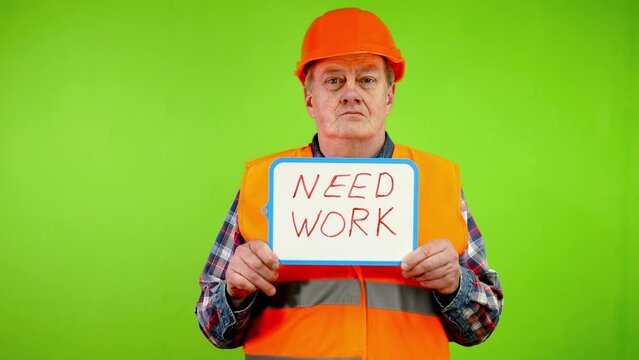 Worker holds in hands inscription need work.