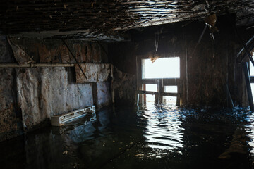 Fototapeta na wymiar Flooded old house interior. Natural disaster concept