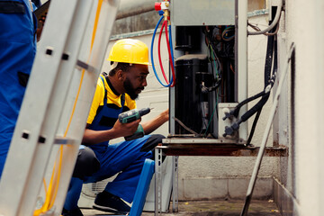 Qualified electricians repairing hvac system electrical issues caused by faulty wiring or damaged air conditioning coolants requiring professional intervention to diagnose and fix