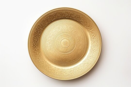 Top view of golden plate isolated on white background.