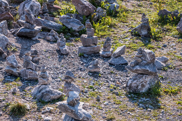 Zen meditation background - balanced stones stack cairn close up. Mountain rock texture closeup for...