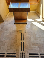 Path for blind or low vision with a textured podotactile surface, so that pedestrians can recognize...
