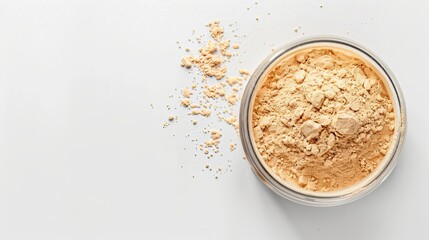 a protein powder in a small clear container, solid white background, top view