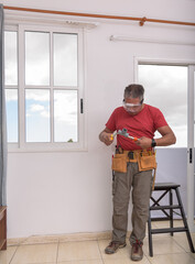 worker using pliers
